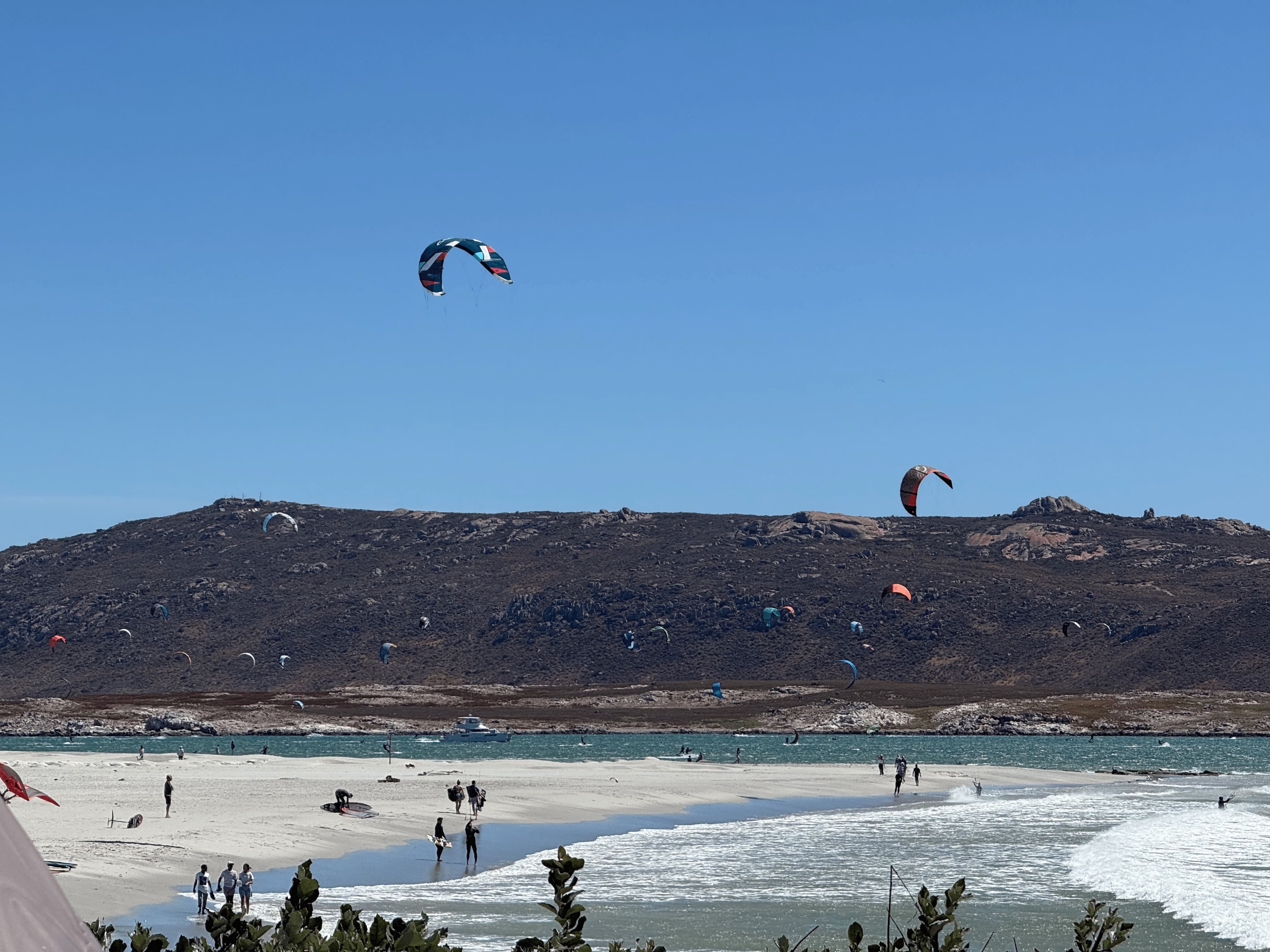 Kitesurfing from the beach at Shark Bay Langebaan